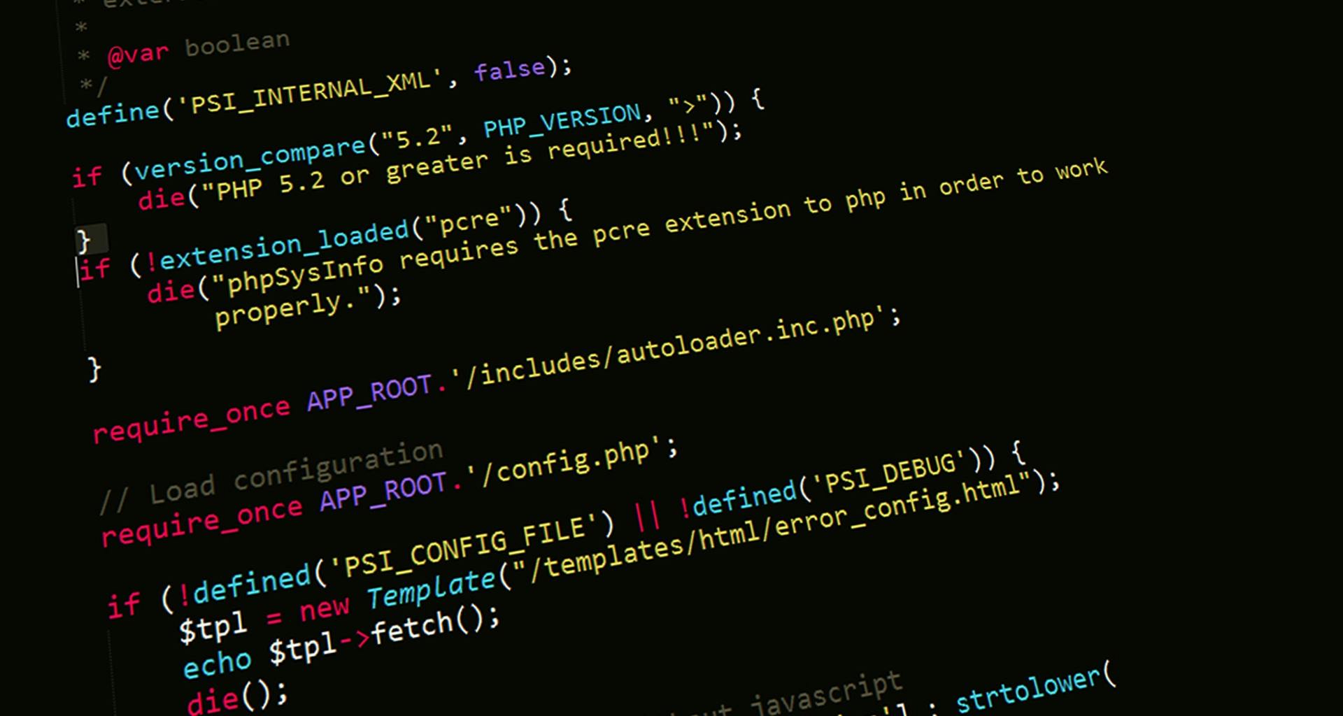 Close-up of HTML code highlighted in vibrant colors on a computer monitor.
